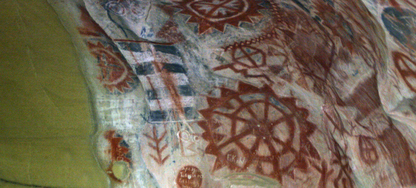 red wheel-shaped cave paintings by the Chumash people
